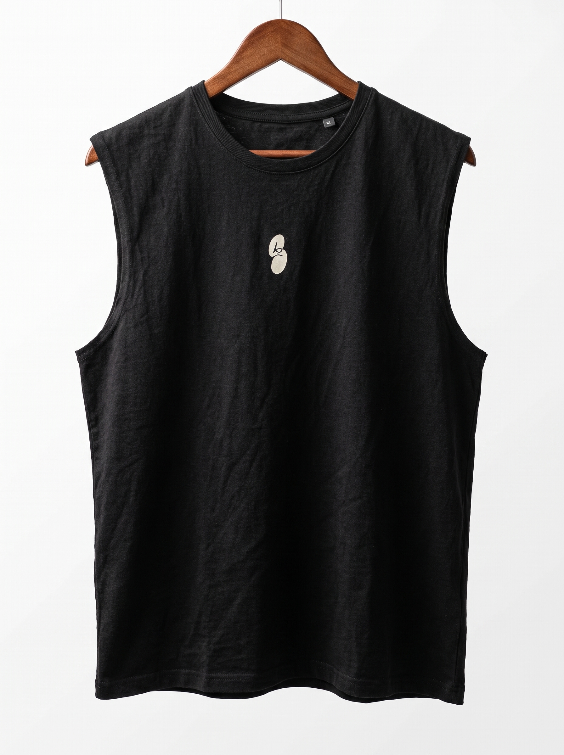 The Current Tank, a black sleeveless tank top on a wooden hanger